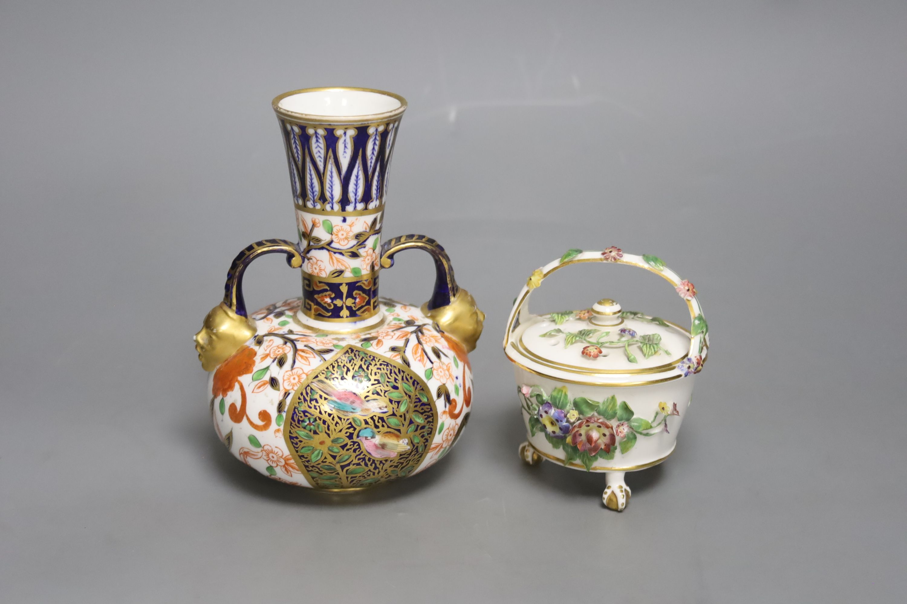 A Royal Crown Derby vase, with two mask head handles painted in Imari style, date code for 1882 and a Derby King Street pot pourri basket and cover c.1900, tallest 16cm